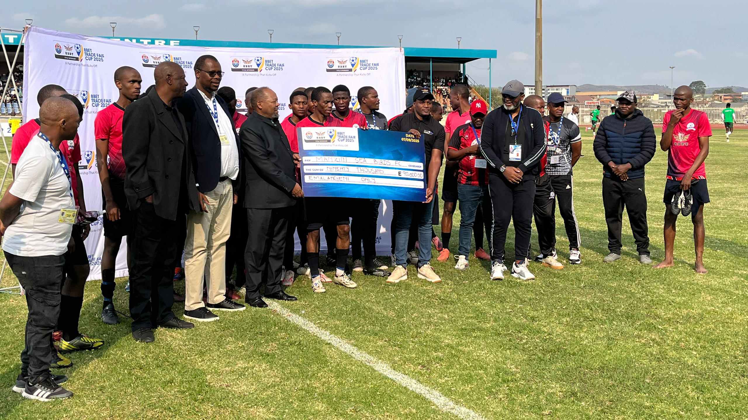 Manzini Sea Birds secure third place! They were awarded a replica cheque of E90 000 after edging Ubombo Sugar 2-1 in the 8Bet Trade Fair Cup third-place play-off. (Pic: Sanele Jele)